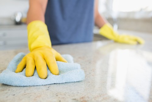 Maidavale home cleaning service preparing a kitchen and dining area
