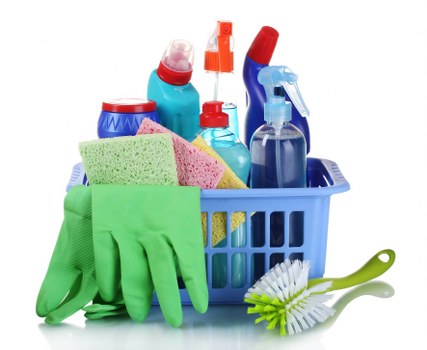 Cleaner wearing PPE while carrying out a safe domestic cleaning task