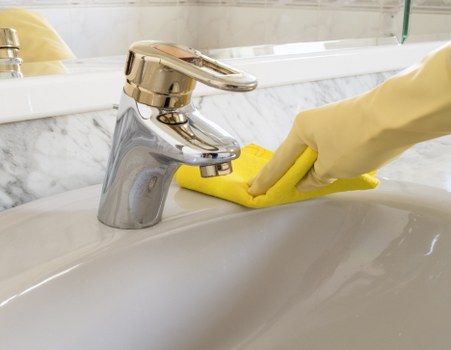Office cleaner keeping a Maidavale workspace spotless